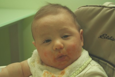 Sammy, 5 1/2 months, covered in sweet potato, looking a bit dazed, 2/27/2006, Mountain View, CA