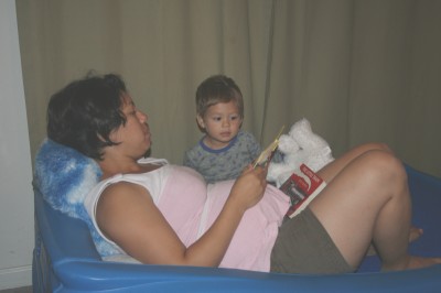 Kimi & Sammy, reading a story, on Sammy's race car bed, Mountain View, CA, August 15, 2007
