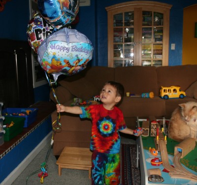 Sammy in tie dye holding his birthday balloons, September 16, 2007, Mountain View, CA