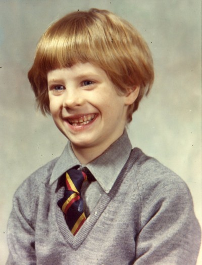 Stephen Mack at about eight years of age; photographer unknown but probably some underpaid greasy-haired guy who hates kids and worked cheap; London, England