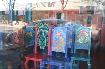 Three decorated wooden chairs through the window of a Mexican restaurant, Mountain View, CA, January 21, 2007